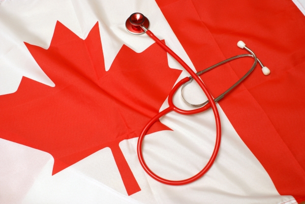 A Canadian flag with a stethoscope resting on it