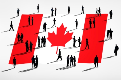 A group of people gathered on a Canadian flag