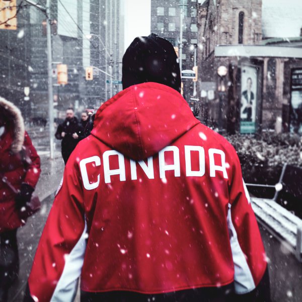 Man wearing Canada jacket in the winter