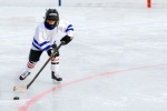 Child playing hockey