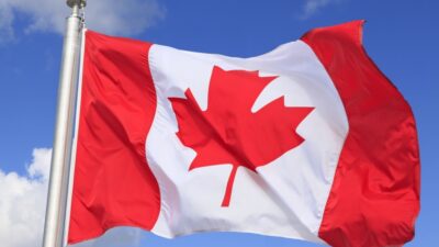 Canada flag over clear sky