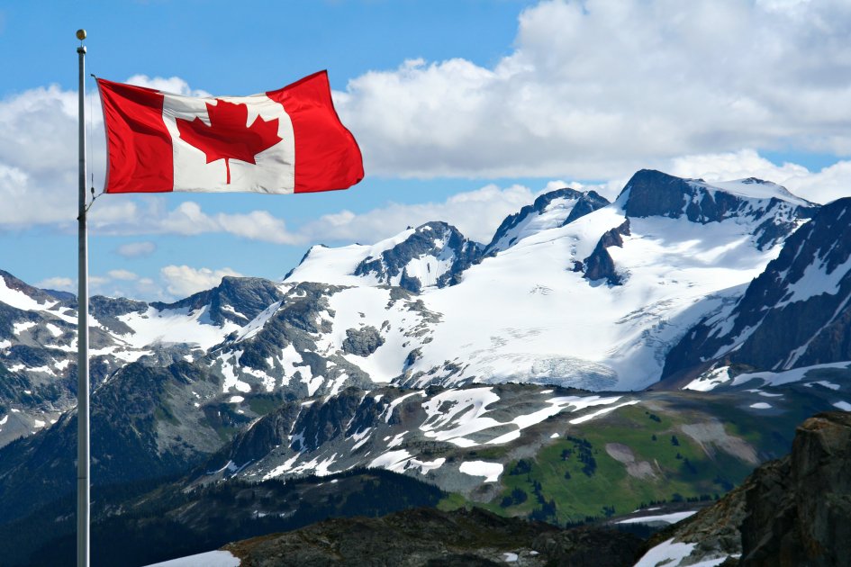A Canadian flag at the rockies in Canada.