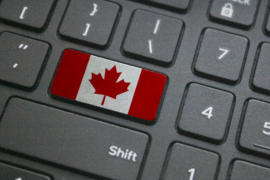 A keyboard with Canadian flag.